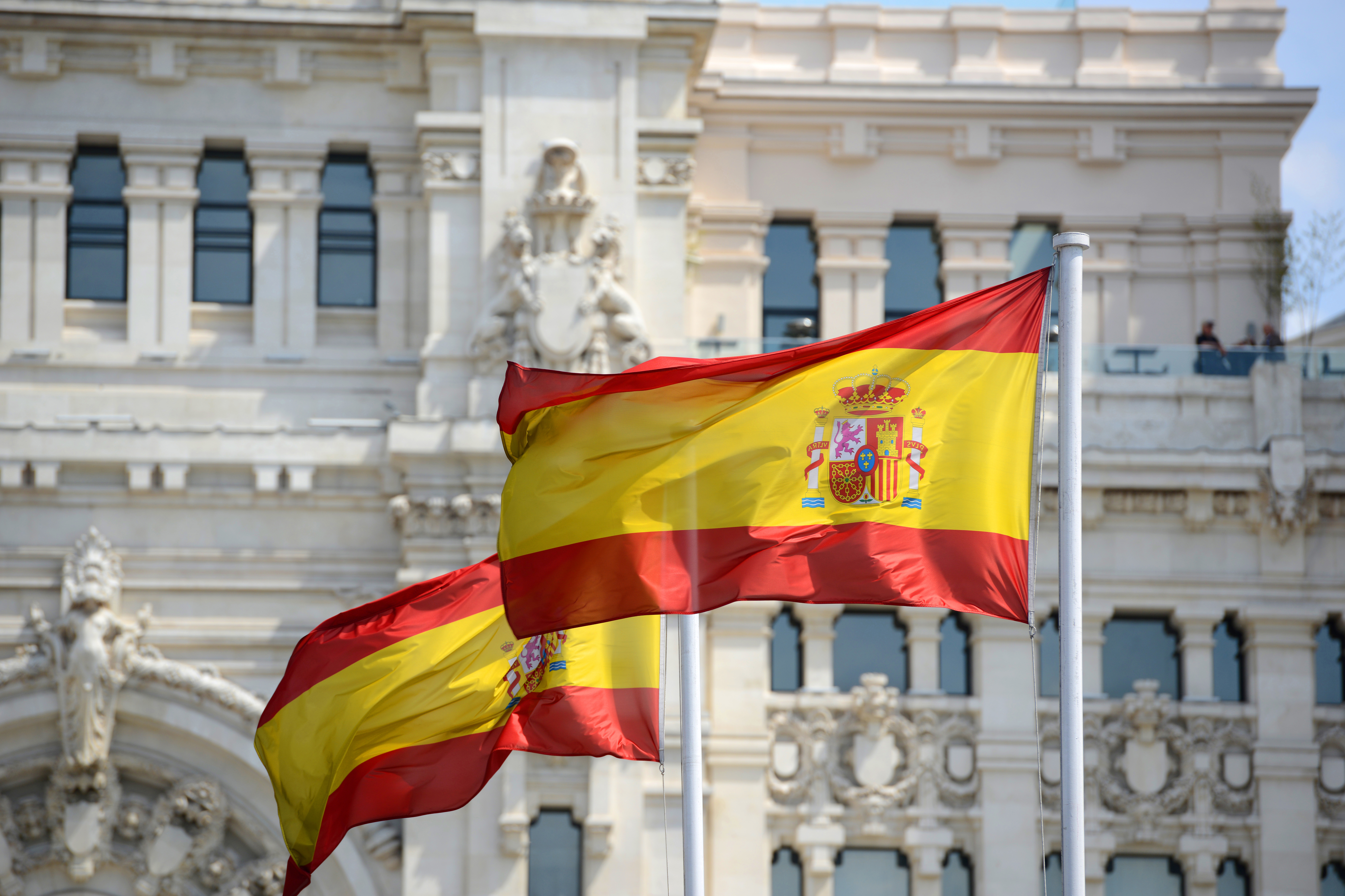 The Spanish flag symbolizes a residence permit in Spain by investment