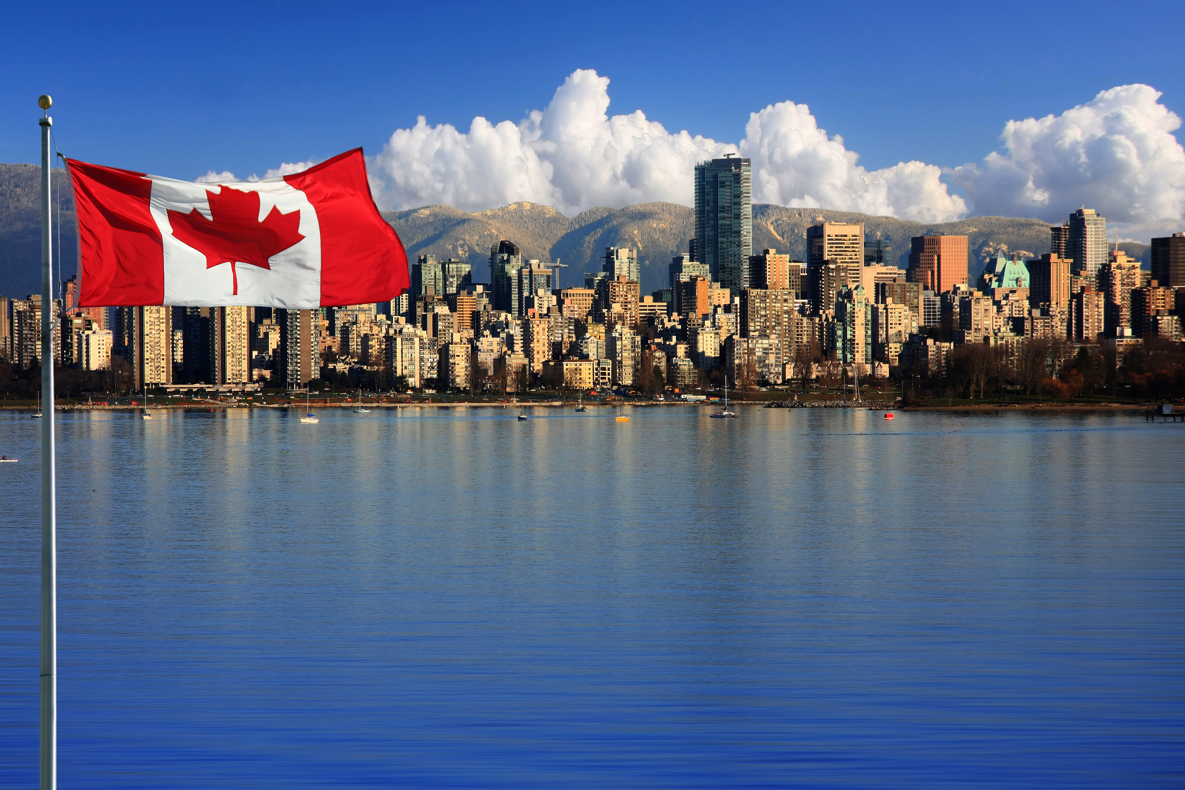 The Canadian flag on the background of the city symbolizes the citizenship of Canada