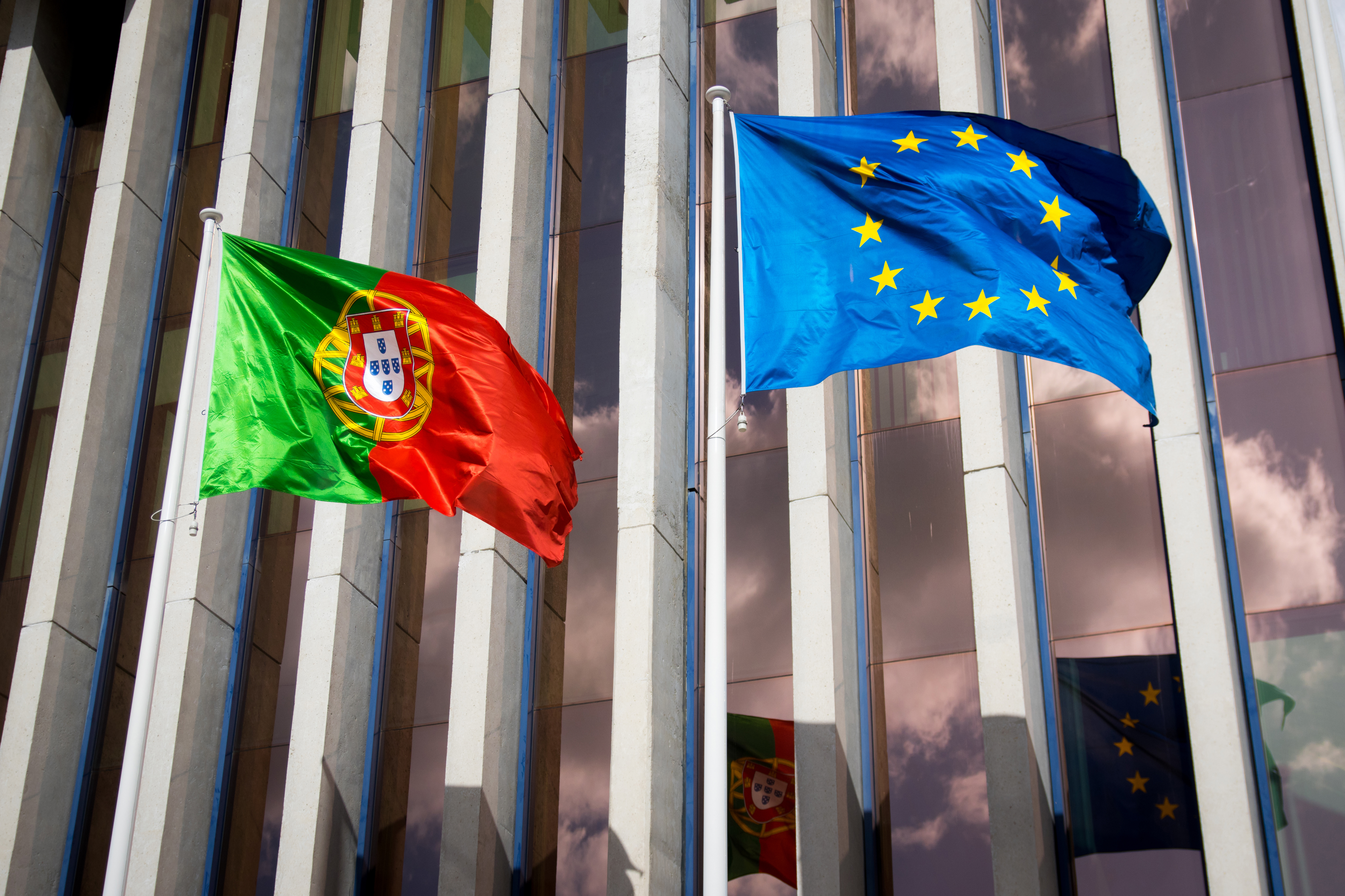Flags symbolizing the citizenship or residence permit of Portugal, a European state