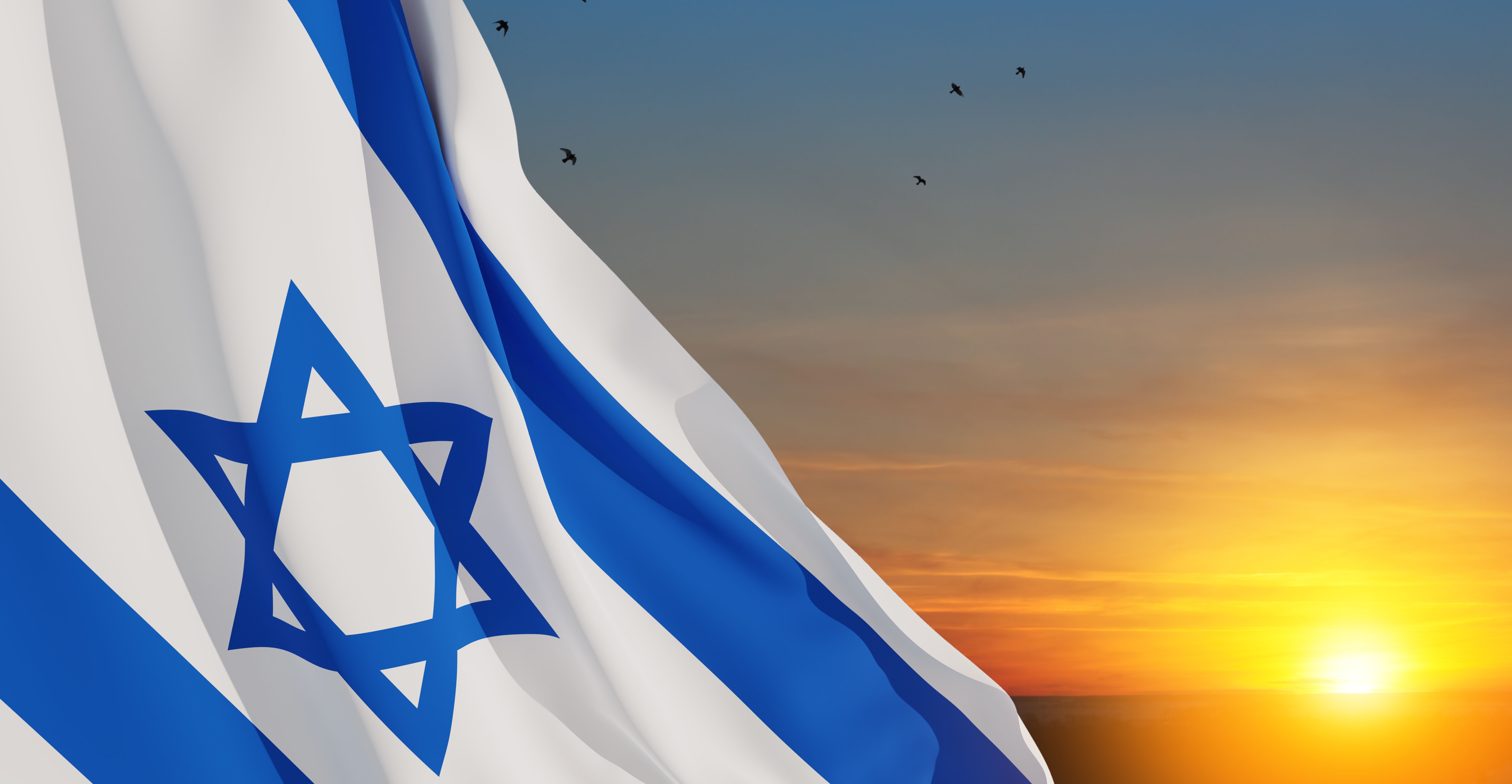 The flag of Israel against the sunset