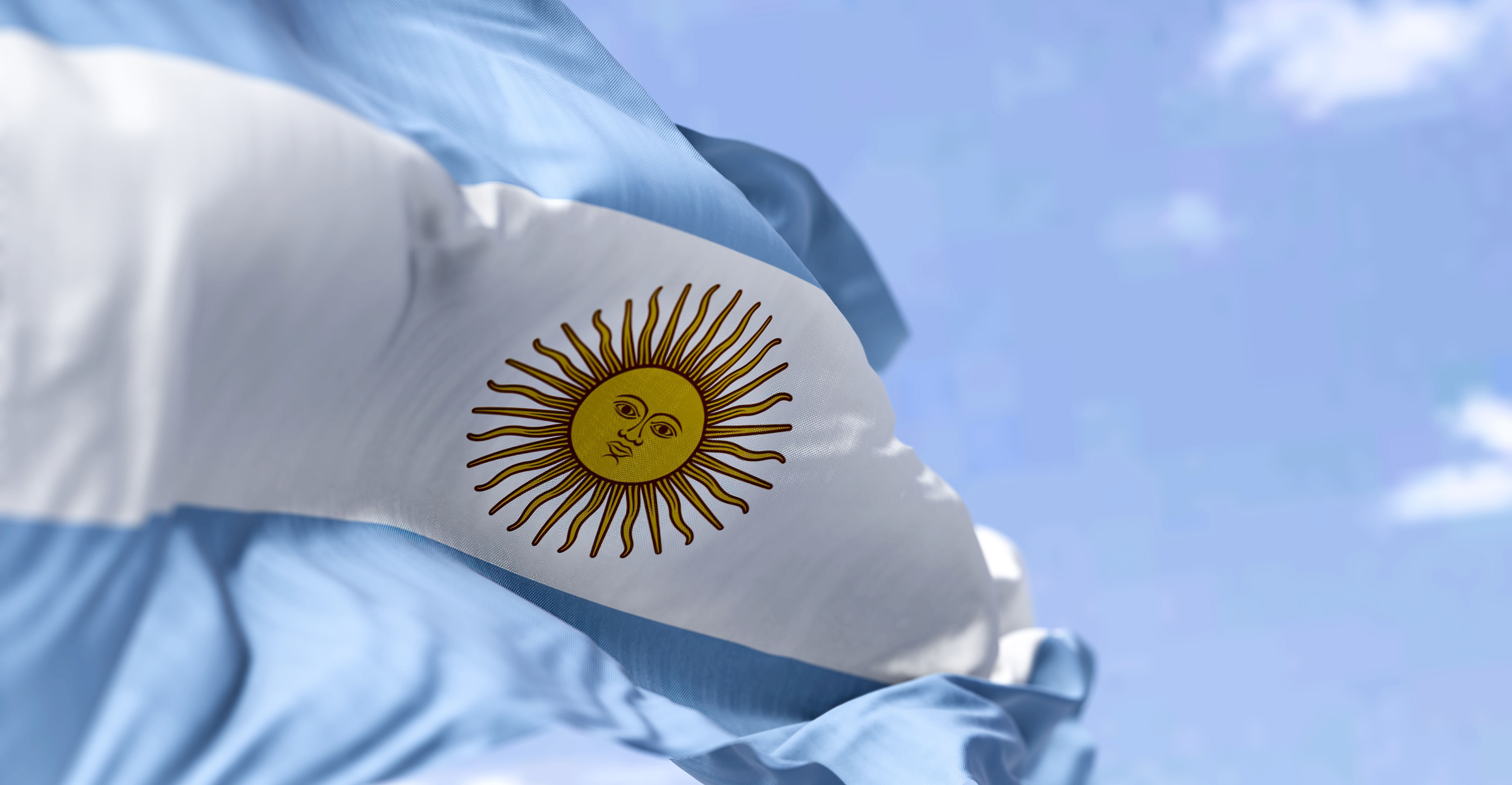 National flag of Argentina against the blue sky