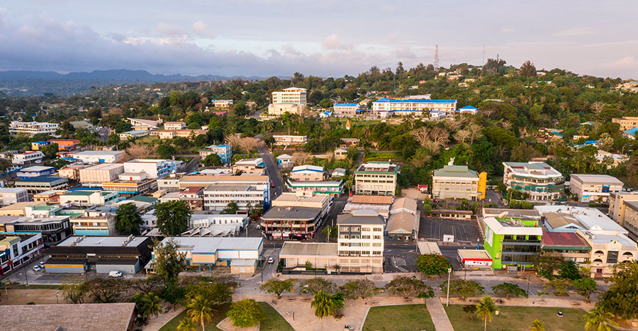 Aerial view of Port Vila city center with the waterfront promenade and the seawall public park