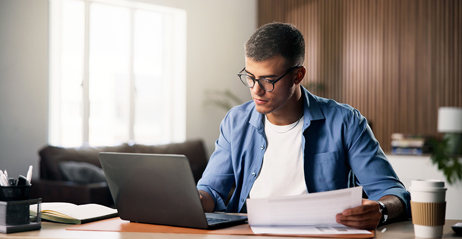 A digital nomad fills out documents for a visa to Spain