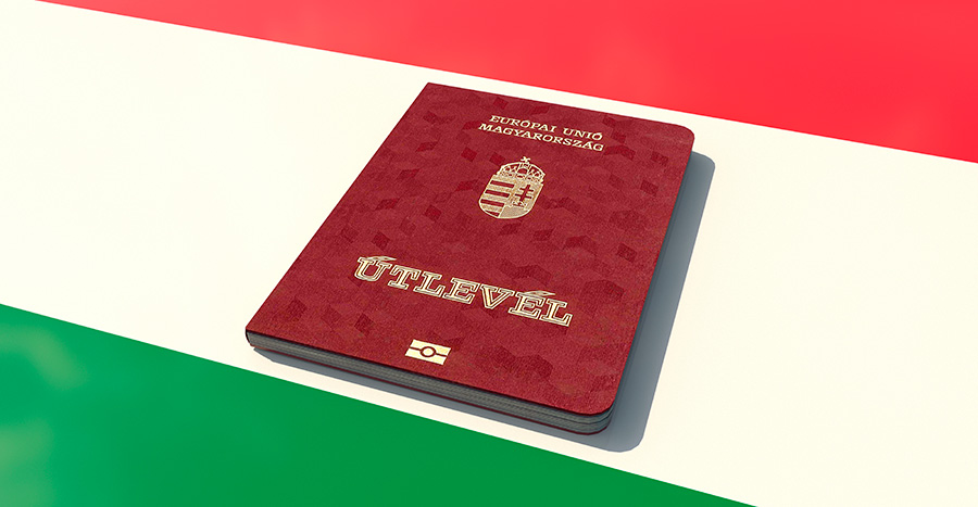 A passport against the background of the country's flag symbolizes a Hungary residence permit